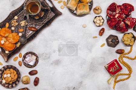 Photo for Banner with traditional Arabic dishes and food sets on it, Koran and rosary. Ramadan table top view - Royalty Free Image