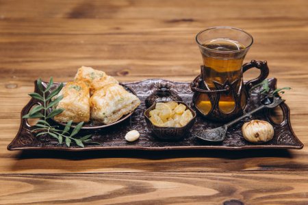 Photo for Ramadan table. Banner with traditional cup of tea, dishes and food sets - Royalty Free Image
