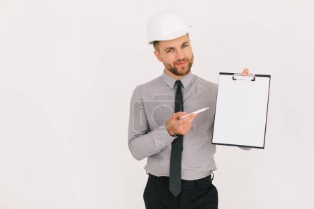 Photo for Happy male chief architect holding a folder with copy space and showing something on a white background - Royalty Free Image