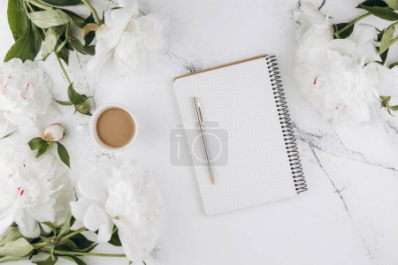 Photo for Beautiful white peony flowers with empty notebook on white marble stone background, copy space for your text or design, top view, flat lay - Royalty Free Image