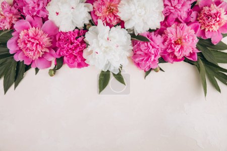 Photo for Flowers composition. Border made of pink and white peony flowers on pastel background. Flat lay. Top view with copy space - Royalty Free Image