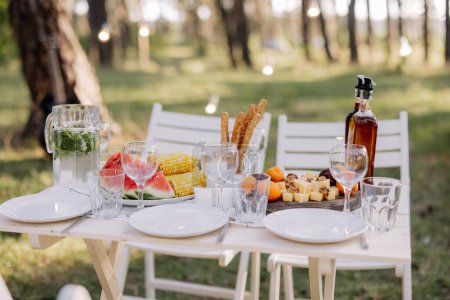 Photo for Decor in boho style. Picnic in the nature, table. Holidays in the nature concept. - Royalty Free Image