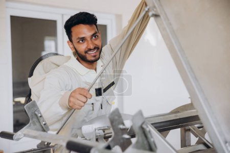 Photo for Portrait of happy young Indian beekeeper working in beekeeping factory - Royalty Free Image