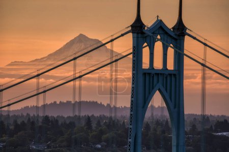 Gothic style arches tracery St Johns bridge and Mt Hood with beautiful sunrise in Portland, Oregon.
