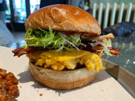 Photo for Eggslut Burger with Bacon and Corn Fritters. ready to eat for breakfast. - Royalty Free Image