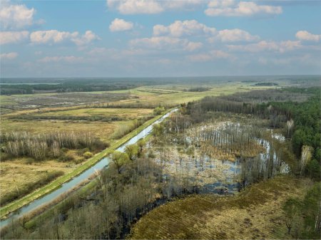 Beautiful drone view of the spring floodwaters of the river, pan
