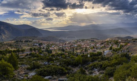 Photo for A view of the village of Chrisso and the Crissaean Gulf in Central Greece after an evening thunderstorm - Royalty Free Image