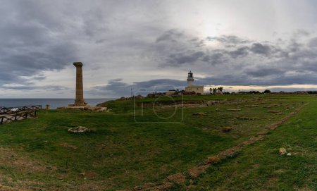 Photo for Capo Colonna, Italy - 6 December, 2023: panorama view of the lighthouse and ancient ruins of Capo Colonna - Royalty Free Image