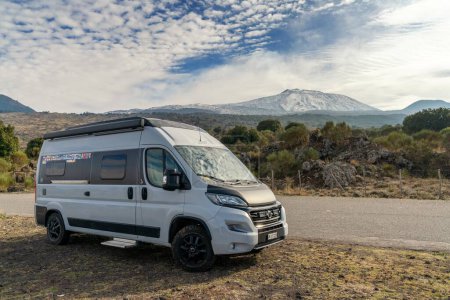 Photo for Randazzo, Italy - 29 December, 2023: camper van parked in the foothills of Mount Etna in the Sicilian backcountry near Randazzo - Royalty Free Image
