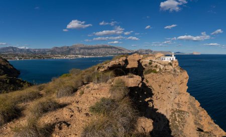 Photo for A view of the Albir Lighthouse on the rocvky promontory in the Serra Gelada Natural Park between Benidorm and Altea - Royalty Free Image