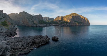 A panorama landscape view of the rugged and mountainous coastline at Sa Calobra in northern Mallorca