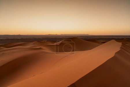 A view of the sand dunes at Erg Chebbi in Morocco at sunset