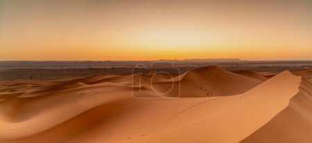 A view of the sand dunes at Erg Chebbi in Morocco at sunset