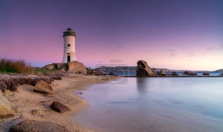 panorama landscape view of the Punta Palau Lighthouse on the Emerald Coast of Sardinia at sunrise