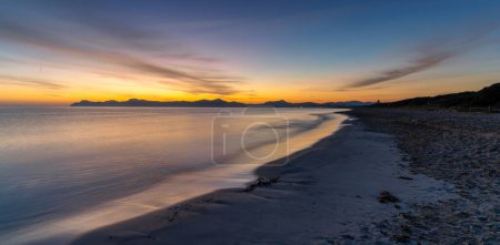 A view of the endless beach at Playa del Muro in Alcudia just before sunrise