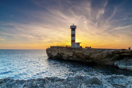 A view of the lighthouse at Colonia Sant Jordi in Mallorca at sunset