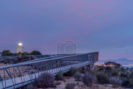 A view of the Santa Pola Lighthouse and Viewpoint Walkway in Alicante Province at sunrise