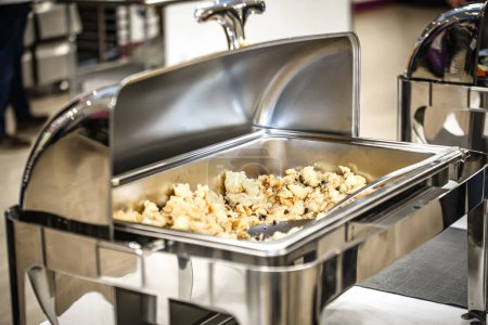 Photo for Catering wedding buffet. Close up of a stainless steel catering buffet in a hotel restaurant. - Royalty Free Image