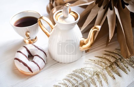 Photo for Christmas Star Made of Kraft Paper.Christmas dkkor on the table during coffee break. Cup and teapot with coffee - Royalty Free Image