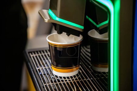 Photo for Coffee machine with two paper cups for take away coffee. - Royalty Free Image