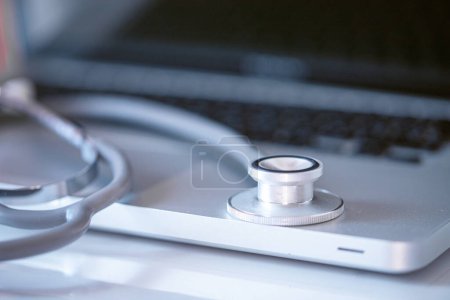 Photo for Medical diagnostic concept: stethoscope placed on a computer keyboard. Information technology in medicine concept - Royalty Free Image