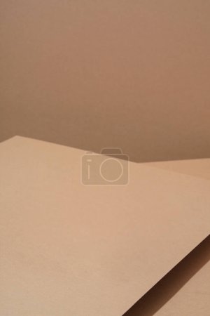 Colorful background from brown paper with shadow. Abstract geometric