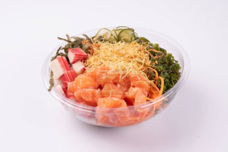 Foto de Saludable oriental japonés comida poke aislado en blanco fondo crudo salmón vista superior - Imagen libre de derechos