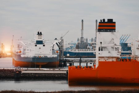 Stern View Of The Crude Oil Carrier And LNG Tanker In The Trade Port