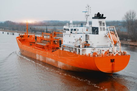 Red Chemical Tanker In Ballast Condition Underway In Busy Narrow Navigational Channel