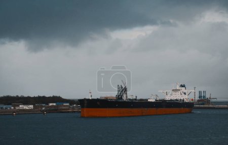 Marine Loading Arm And Crude Oil Carrier Tanker In The Harbour E