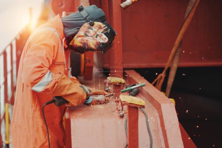 Seaman Seafarer Welder In Safety Protective Clothes Working With