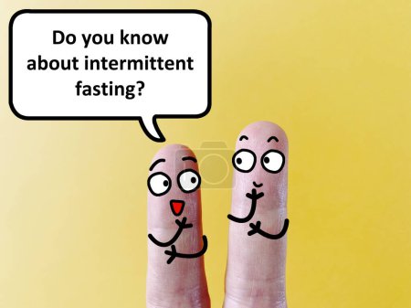 Photo for Two fingers are decorated as two person. They are talking about health problem. One of them is asking another if he knows about interminttent fasting. - Royalty Free Image