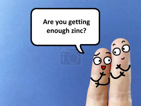 Photo for Two fingers are decorated as two person. They are talking about health problem. One of them is asking another if he is getting enough zinc. - Royalty Free Image