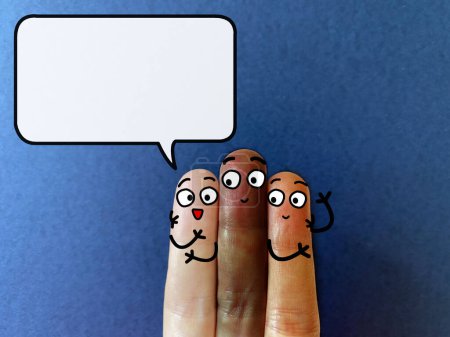 Photo for Three fingers are decorated as three person. They have different skin color. One of them is talking. - Royalty Free Image