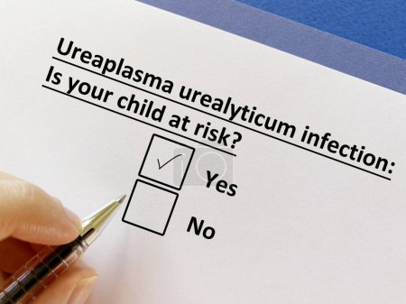 Photo for One is answering question about child infection. His child is at risk for ureaplasma urealyticum infection. - Royalty Free Image