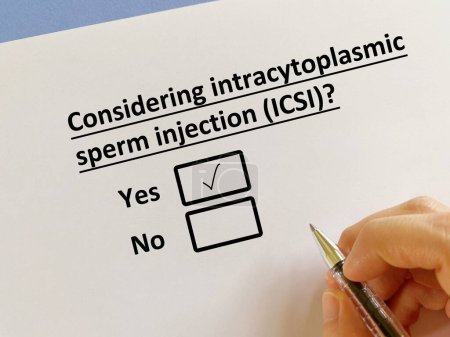 Photo for A person is answering question about infertility. He is considering intracytoplasmic sperm injection (ICSI) - Royalty Free Image