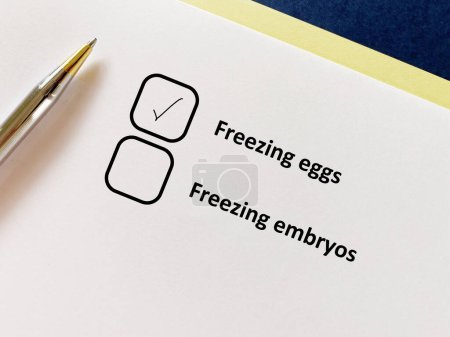 Photo for A person is answering question about infertility. She chooses freezing eggs over freezing embryos - Royalty Free Image