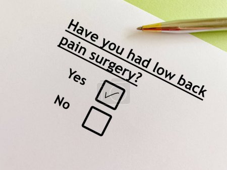 Téléchargez les photos : One person is answering question about surgical procedure. He had low back pain surgery. - en image libre de droit