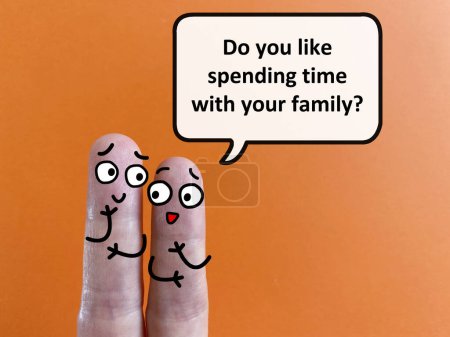 Téléchargez les photos : Two fingers are decorated as two person. One of them is asking another if he likes spending time with his family. - en image libre de droit