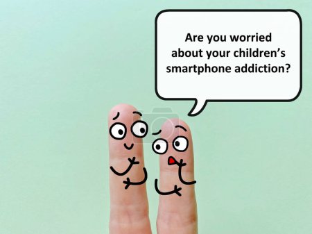 Téléchargez les photos : Two fingers are decorated as two person. One of them is asking another if he is worried about his children's smartphone addiction. - en image libre de droit