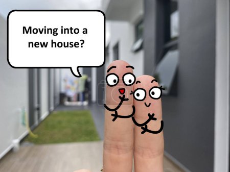 Téléchargez les photos : Two fingers are decorated as two person standing outside a new house. One of them is asking another if she is moving into a new house. - en image libre de droit