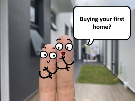Téléchargez les photos : Two fingers are decorated as two person standing outside a new house. One of them is asking another if he is buying his first home. - en image libre de droit