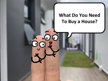 Foto de Two fingers are decorated as two person standing outside a new house. One of them is asking another what is needed to buy a house. - Imagen libre de derechos