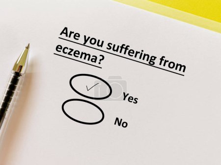 Photo for A person is answering question about illness. She is suffering from eczema. - Royalty Free Image