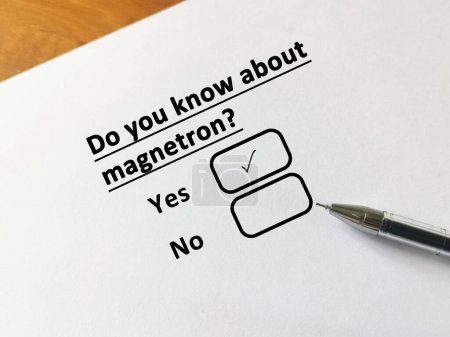 Photo for A person is answering question about food manufacturing. He knows about magnetron. - Royalty Free Image