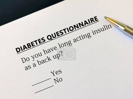 Foto de A person is answering question about diabetes. He is thinking if he has long acting insulin as a back up. - Imagen libre de derechos