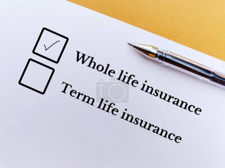 Téléchargez les photos : One person is answering question. He thinks he is choosing whole life insurance. - en image libre de droit