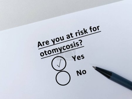 Photo for One person is answering question about ENT disease. He is at risk for otomycosis. - Royalty Free Image