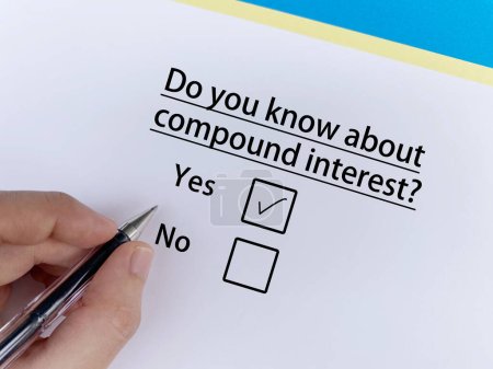 A person is answering question about banking. He knows about compound interest.