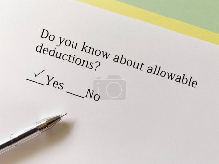 Photo for A person is answering question about taxation. He knows about allowable deduction. - Royalty Free Image